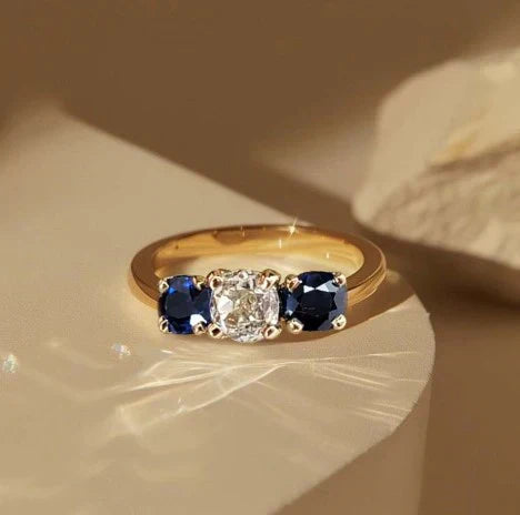 1+1 Offer: Golden Three Stone Cushion Cut White &amp; Blue Sapphire Wedding Band Ring for Women + Round Cut White Sapphire Gold Necklace